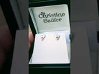 video of handmade silver heart earrings in a modern matt finish set with rubies