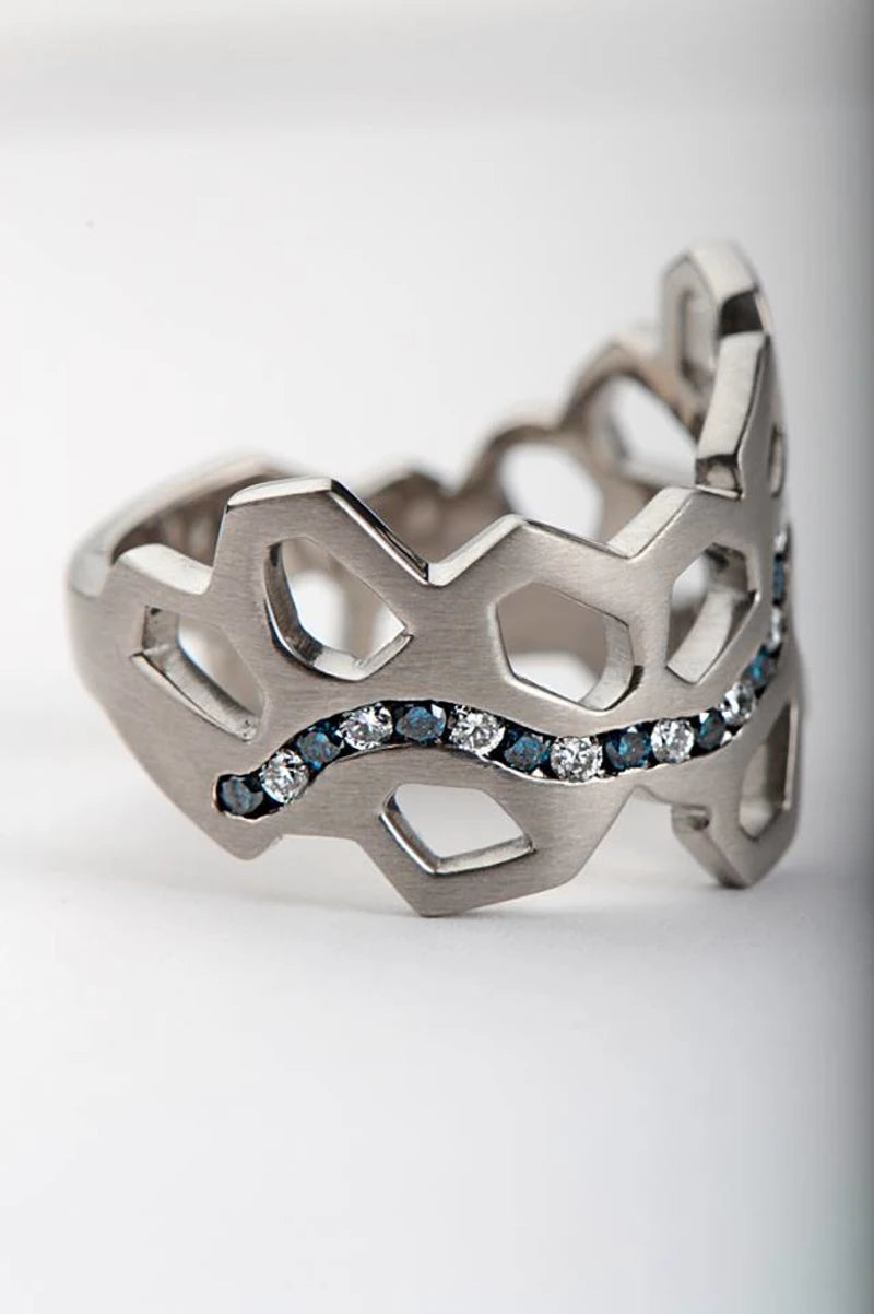 unique wedding ring with pomegranate cut our shapes and blue and white alternating diamonds - christine sadler
