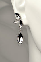 modern silver drop earrings with four concave silver shapes in highly polished and contrasting modern textured finish. Called The Promise, a tree is planted for each piece of this design sold by Christine Sadler