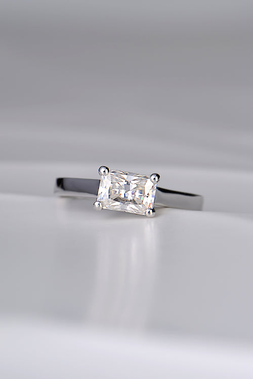 contemporary designer engagement ring handmade in the UK. Rectangular gemstone sitting across the ring in a white gold band.