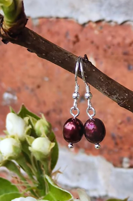 real cultured pearls drop earrings that are red with sterling silver hooks