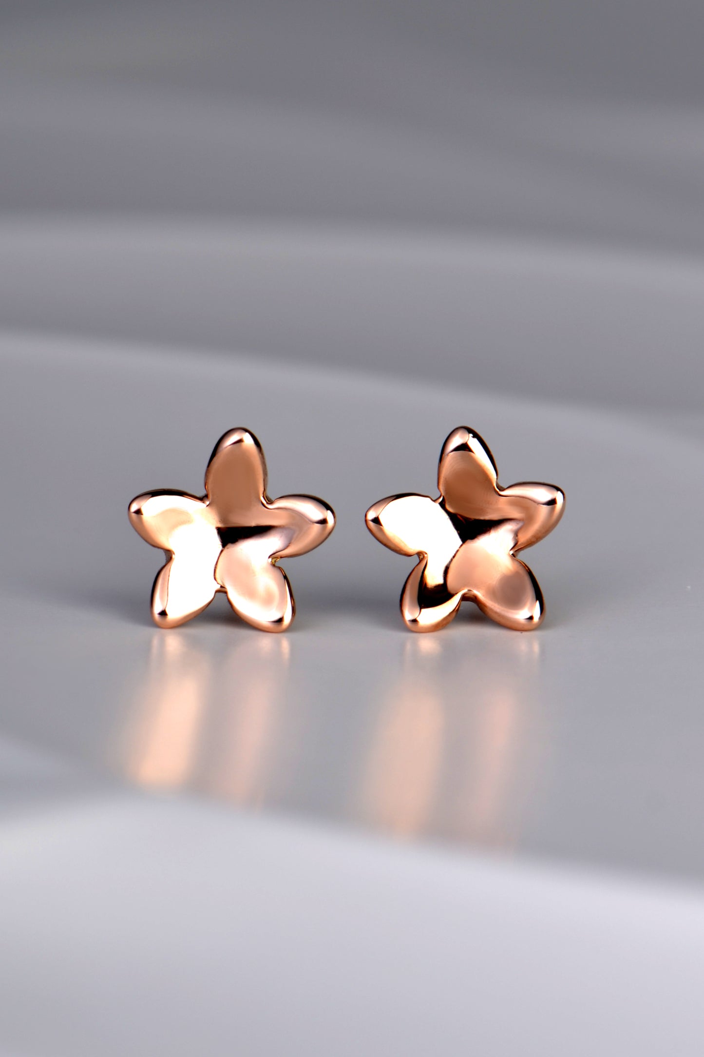 small designer rose gold flower stud earrings