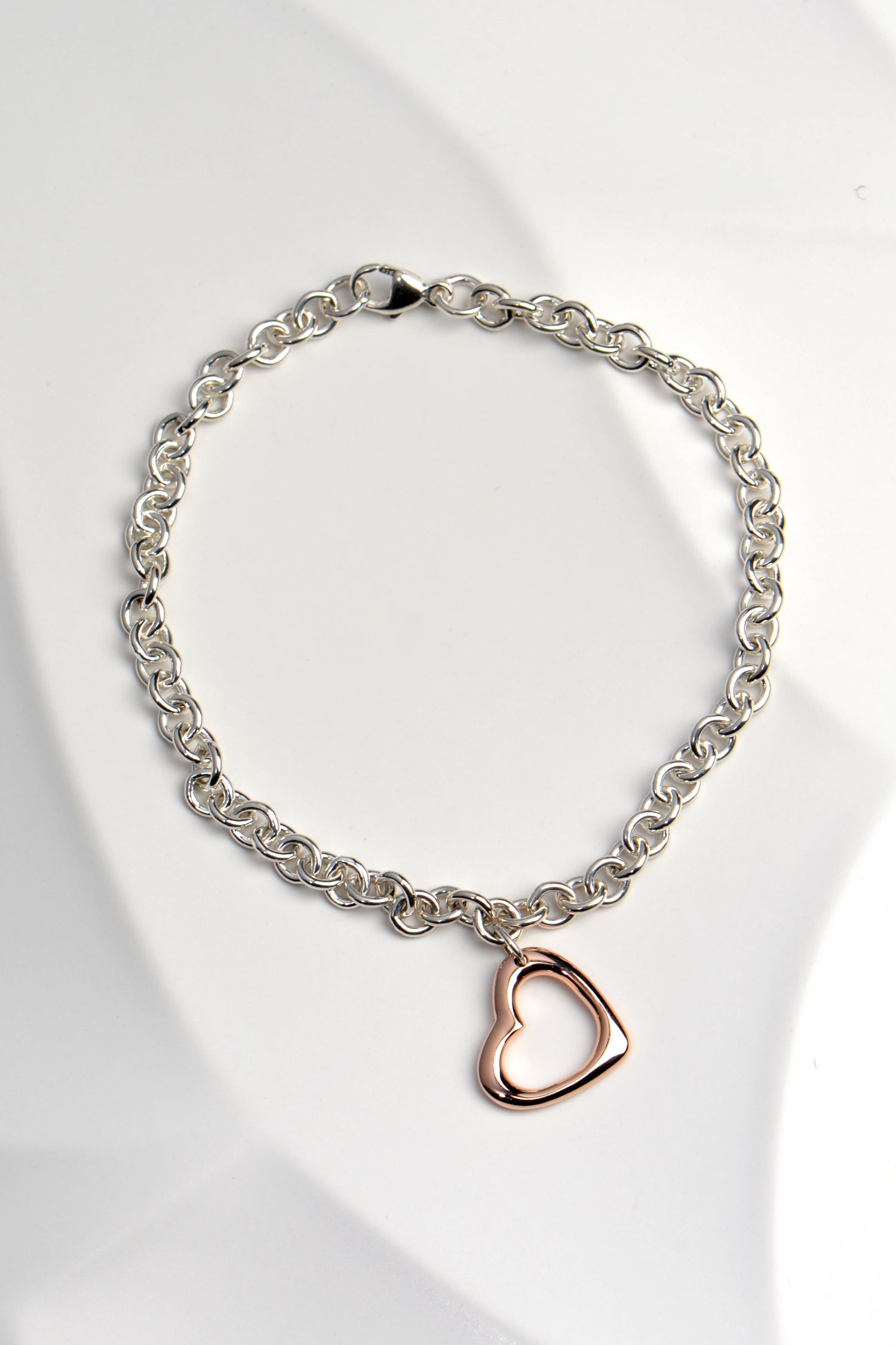 handmade rose gold open heart on silver bracelet