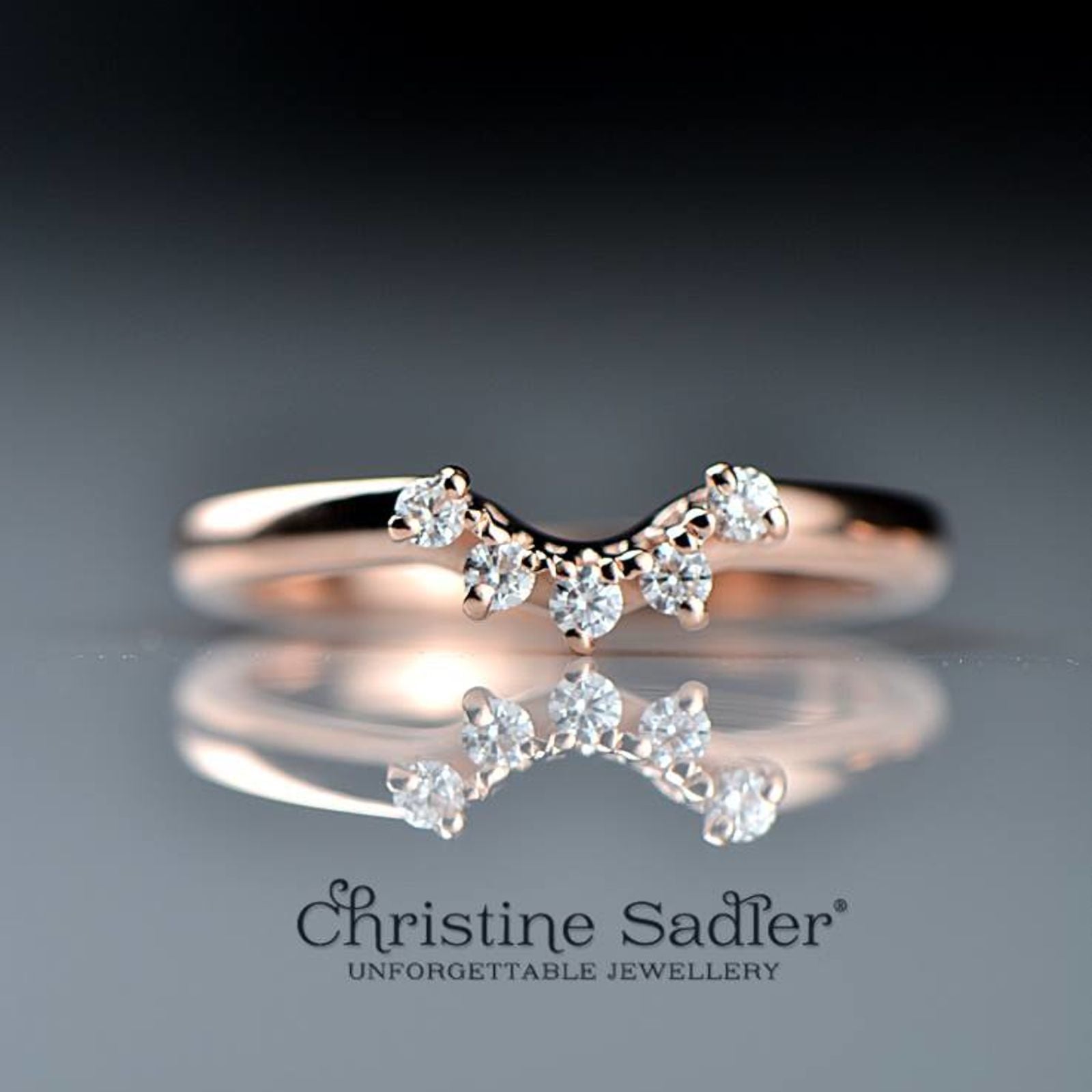 rose gold shaped wedding ring claw set with five diamonds