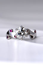 really special two carat diamond ring set with a large central diamond and six small rubies in a unique fire and flame design by scottish jewellery designer Christine Sadler