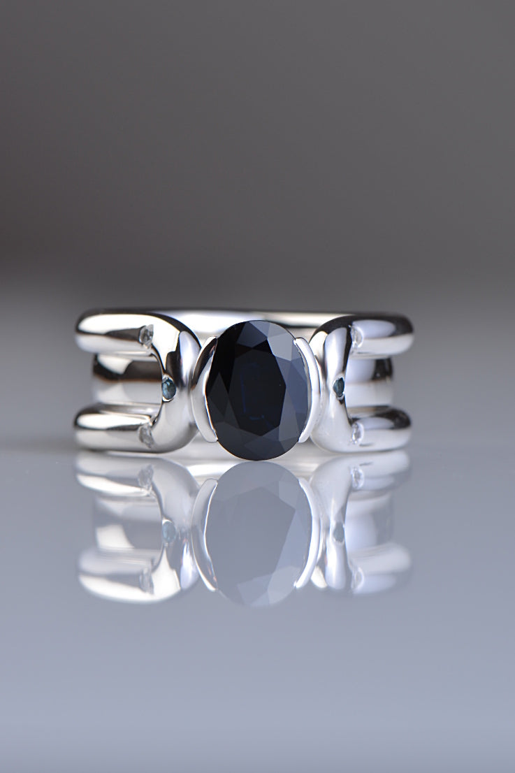 one-of-a-kind silver and sapphire wedding and engagement ring set that fit into ach other - copyrighted to jewellery designer Christine Sadler