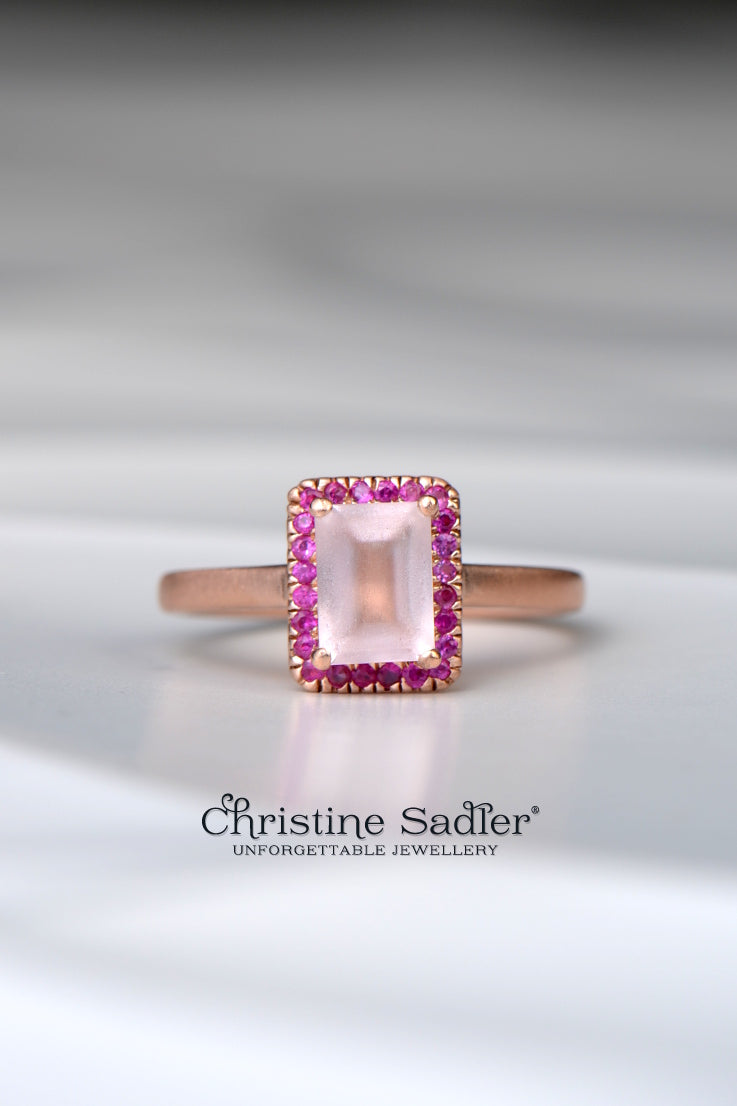 one-of-a-kind rose gold halo ring with a rectangular satin morganite and pink sapphires around it - Christine Sadler