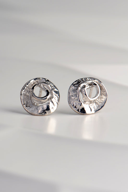 small silver earrings inspired by the texture of seaweed