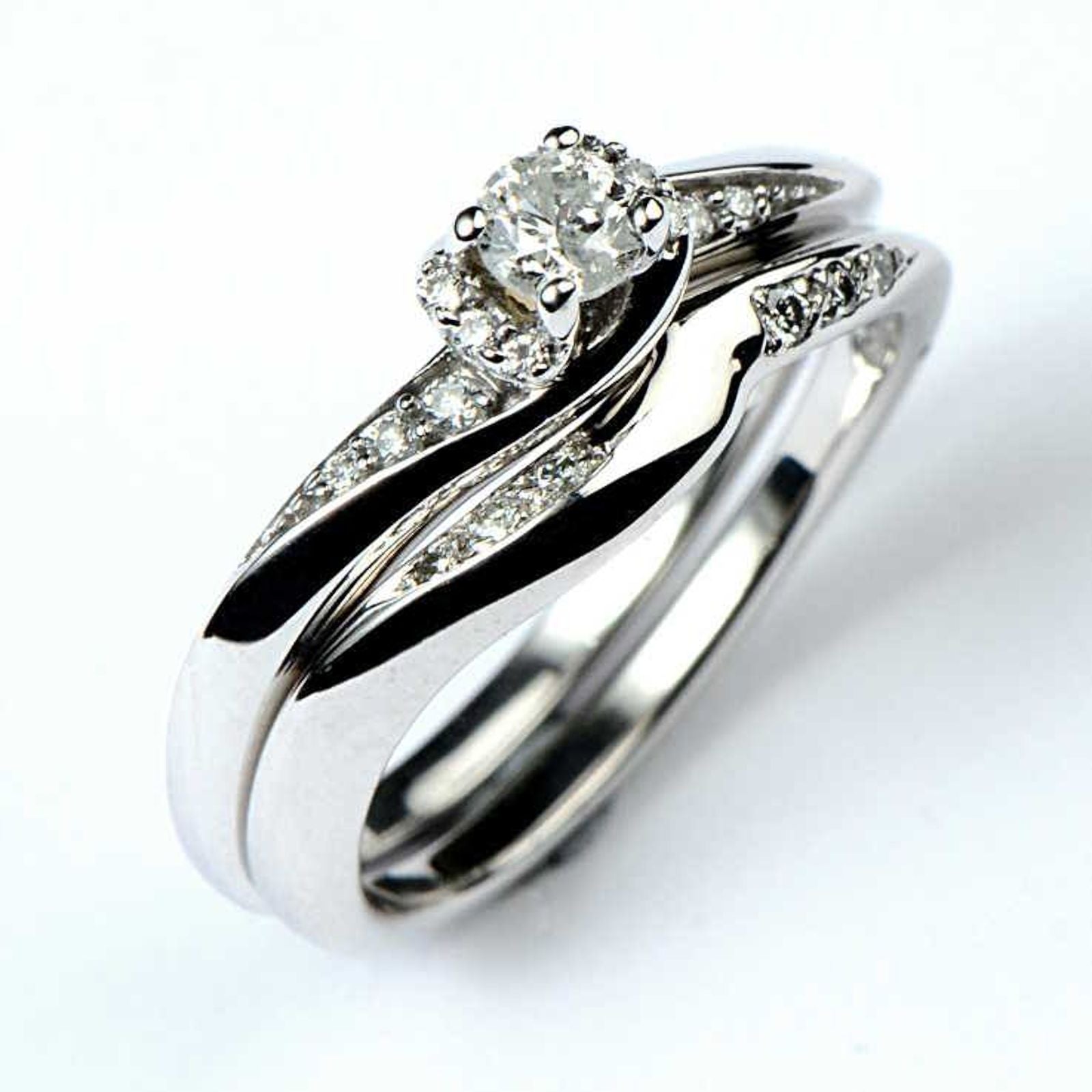 custom shaped wedding ring made to fit with engagement ring from Christine Sadler