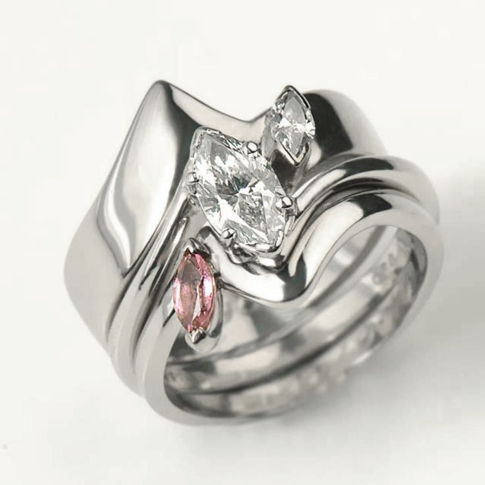 Bespoke bridal ring set with marquise diamonds. Wedding ring, engagement ring and a ring made for the birth of a baby girl all fit together perfectly - Christine Sadler