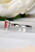 Side profile view of a platinum Moi et Toi ring highlighting the claw setting of the 1.29 carat radiant cut fancy vivid pink lab diamond, by Christine Sadler.