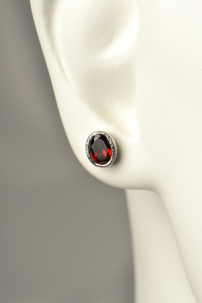 oval garnet earrings in a handmade silver stud design