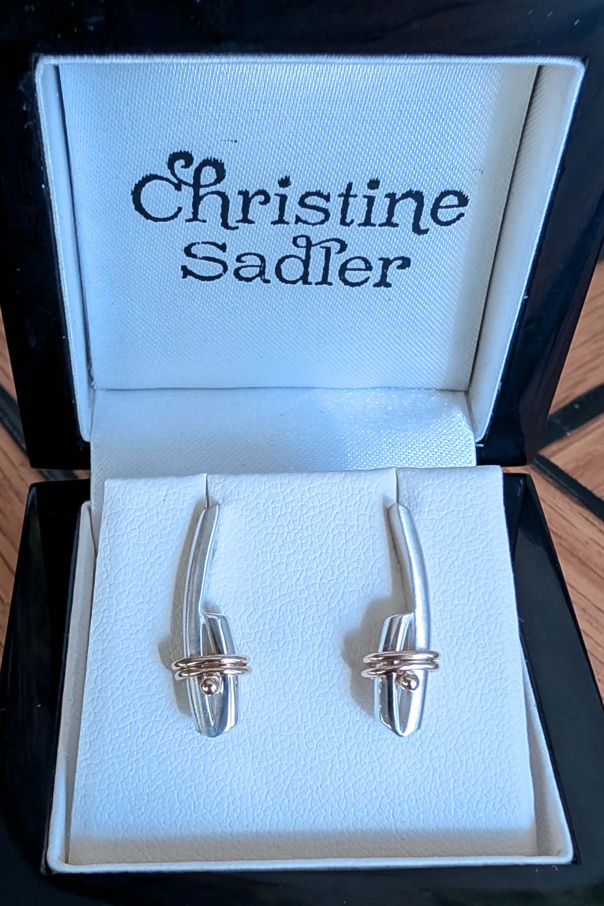 Handmade sterling silver earrings with 9ct wrapped gold wire from the Stay Together collection by Christine Sadler.