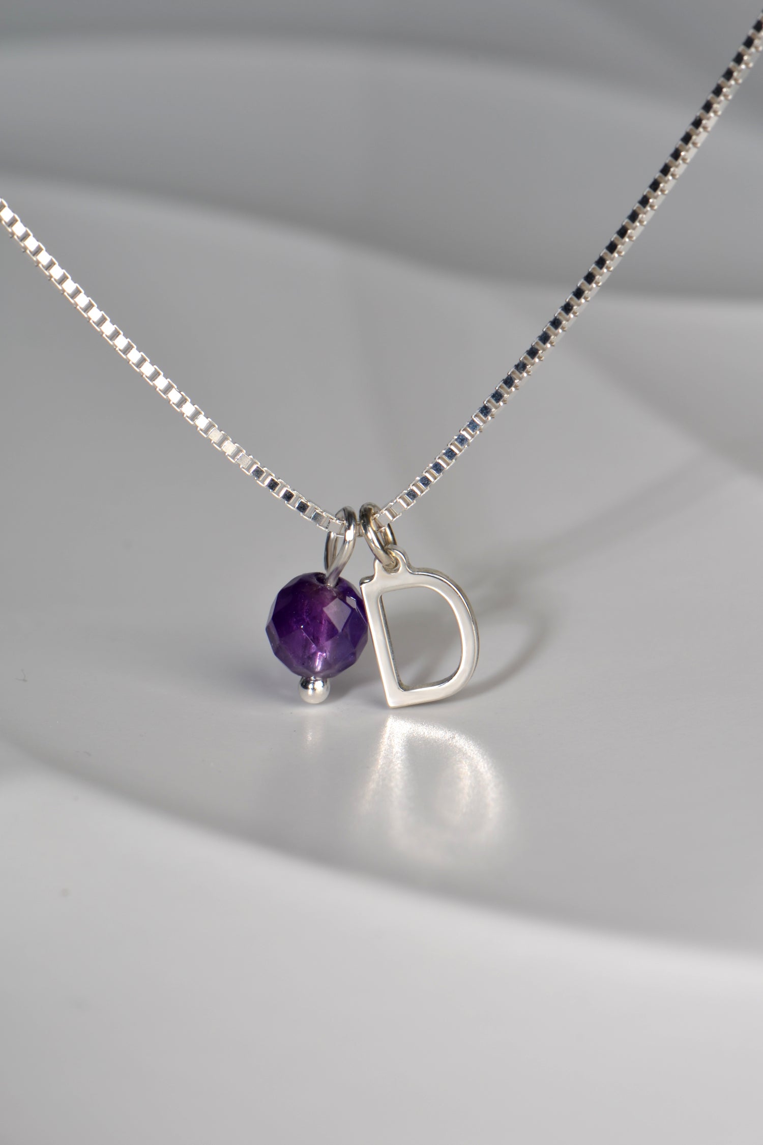 real amethyst with silver initial on silver necklace