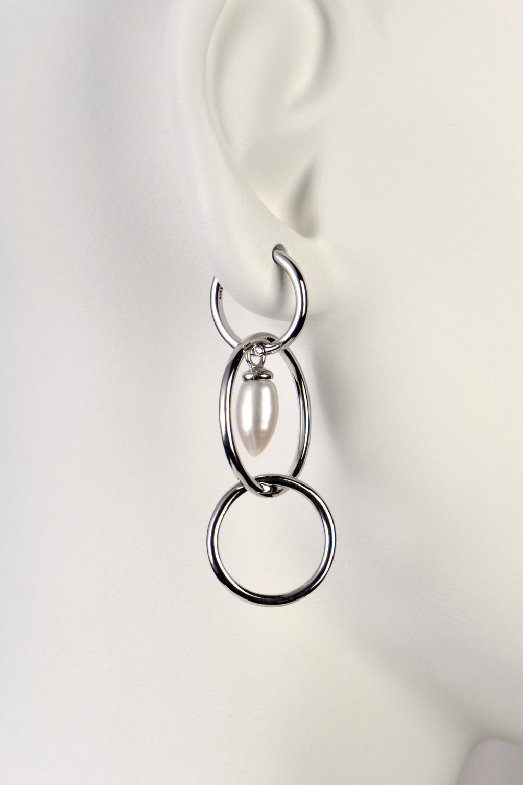 modern pearl and silver long drop earrings by jewellery designer Jorge Revilla
