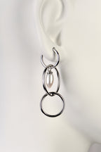 modern pearl and silver long drop earrings by jewellery designer Jorge Revilla