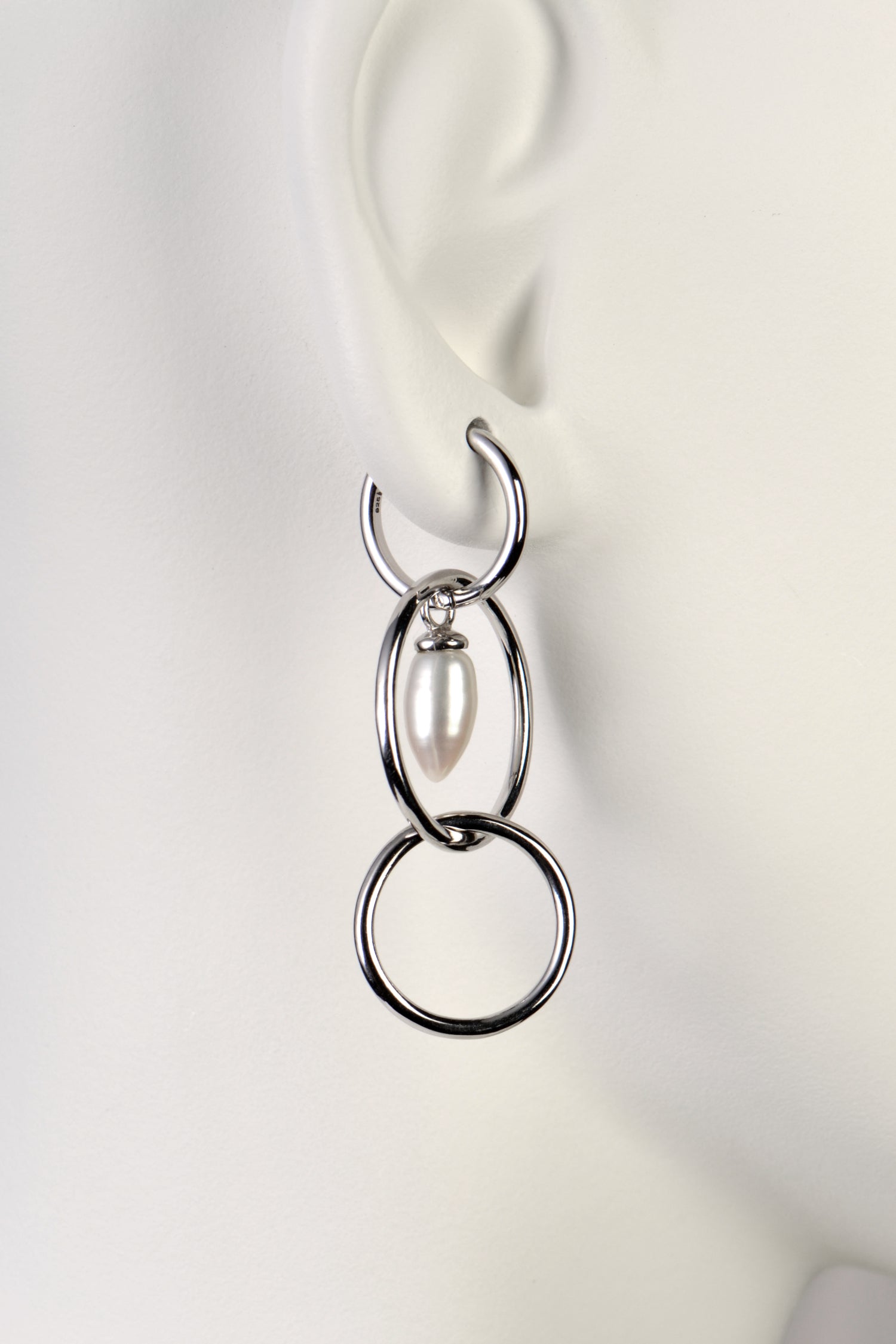 modern pearl and silver long drop earrings by jewellery designer Jorge Revilla