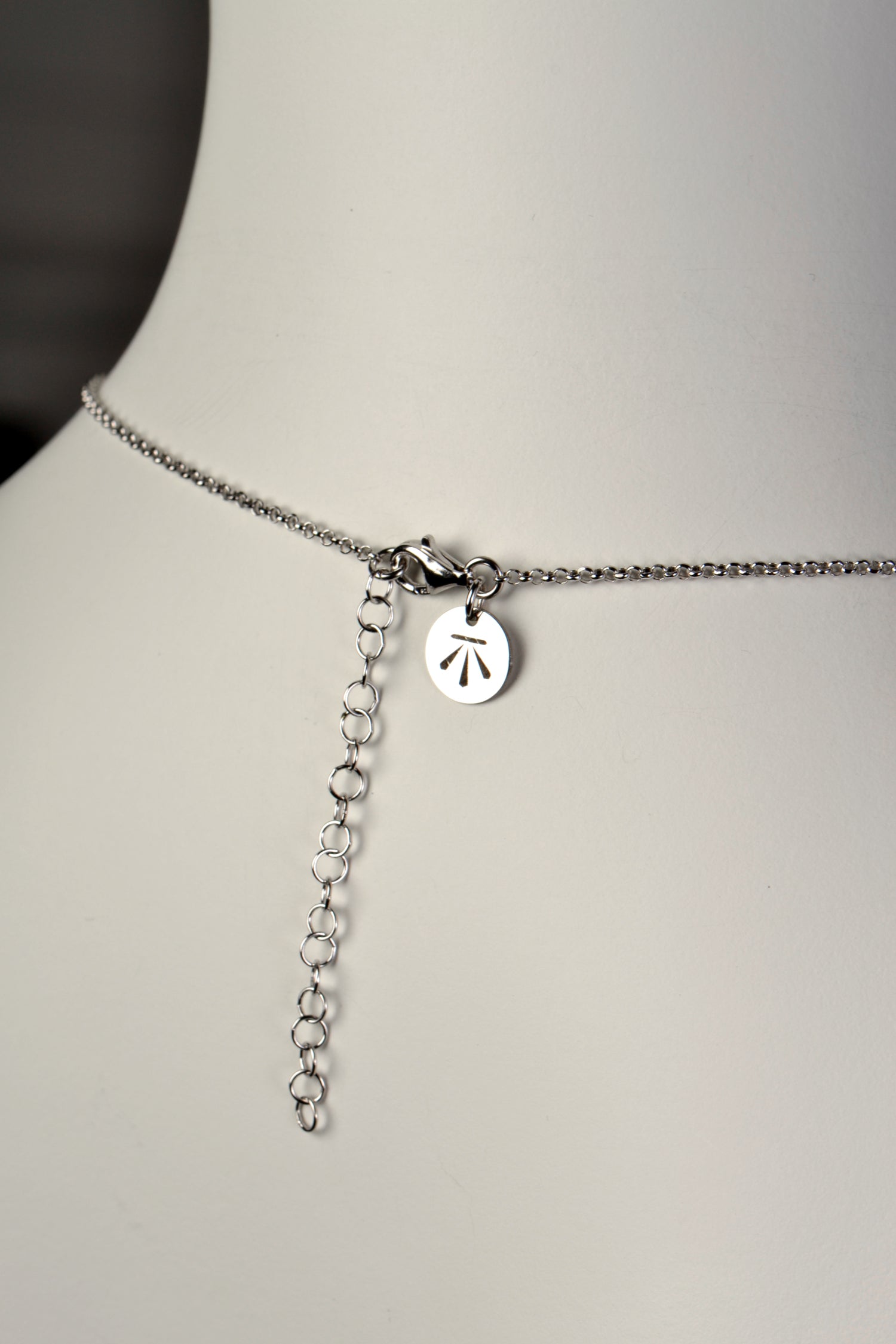 silver knot necklace with adjustable chain so it can be worn at different lengths