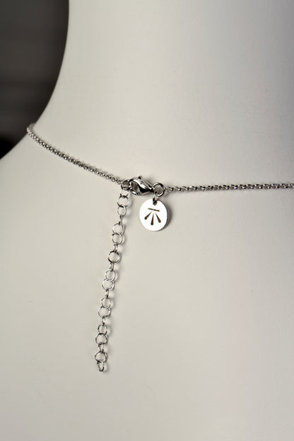silver knot necklace with adjustable chain so it can be worn at different lengths
