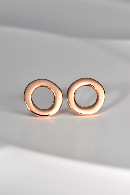 round rose gold designer earrings with hole in middle