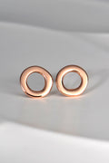round rose gold designer earrings with hole in middle