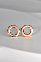 round rose gold designer earrings with hole in middle