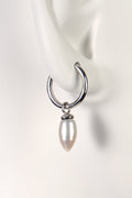 small silver hoop earrings with white pearls designer Jorge Revilla