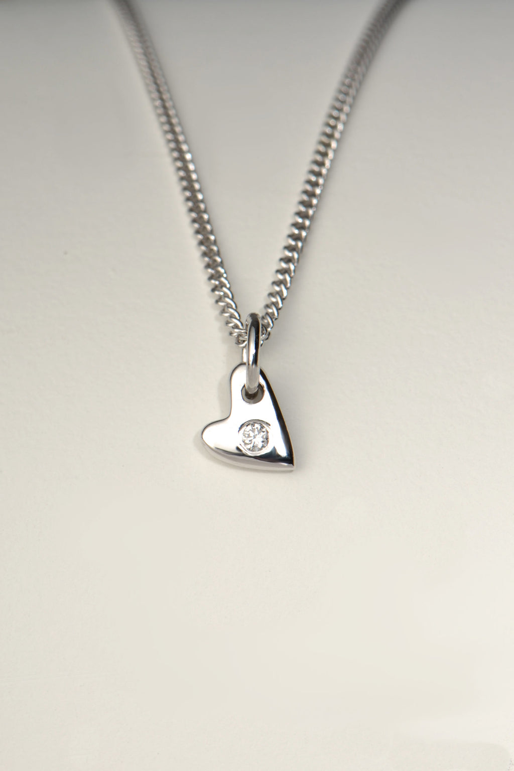 handmade small white gold heart set with a diamond in the middle on a white gold chain - Christine Sadler