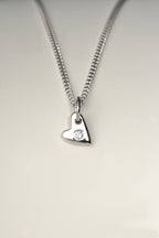 handmade small white gold heart set with a diamond in the middle on a white gold chain - Christine Sadler