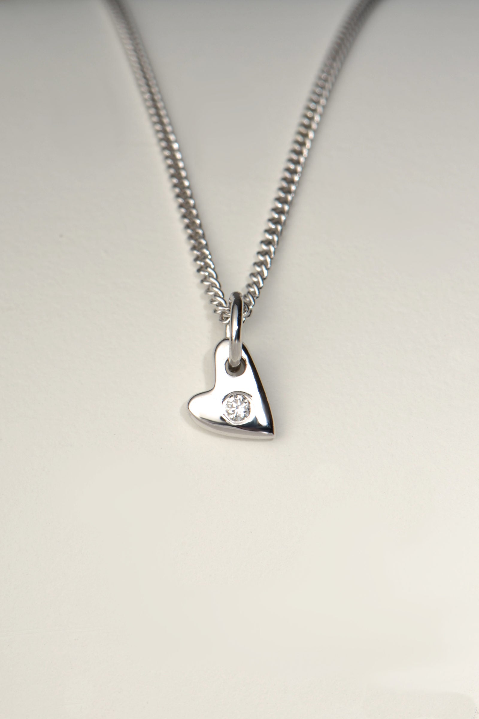 handmade small white gold heart set with a diamond in the middle on a white gold chain - Christine Sadler