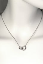 interlocking silver circle necklace with two oval egg shaped links at the front, one larger and one smaller, on a fine silver chain. Part of Christine Sadler's Soulmates collection