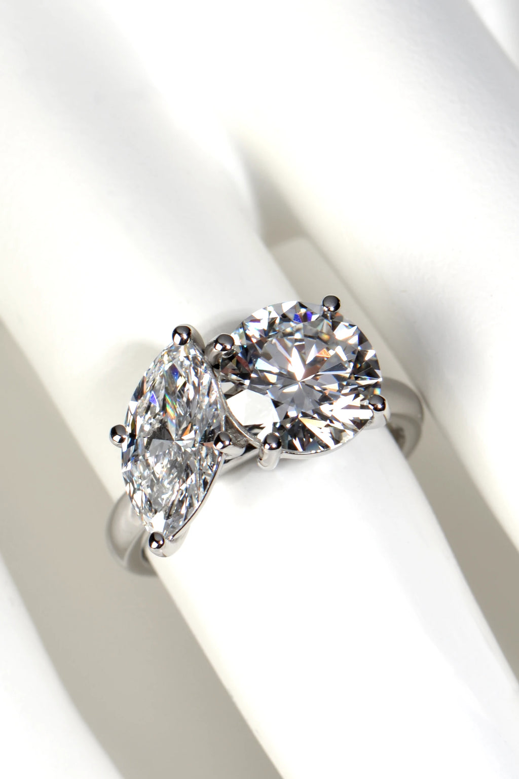 Proportions and finger coverage of a 4.59 carat total weight Toi et Moi lab diamond ring shown on a mannequin hand by Christine Sadler