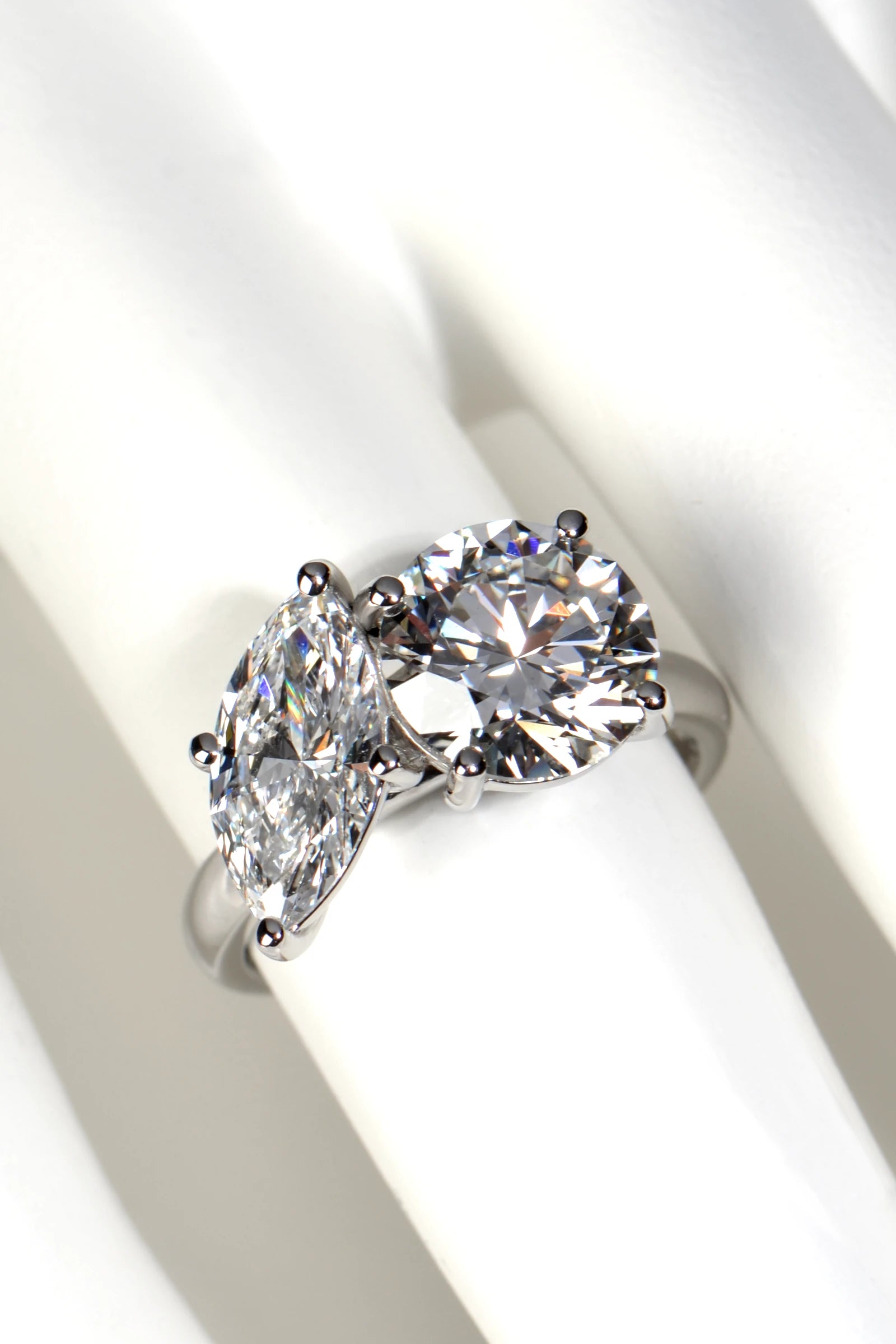 Proportions and finger coverage of a 4.59 carat total weight Toi et Moi lab diamond ring shown on a mannequin hand by Christine Sadler