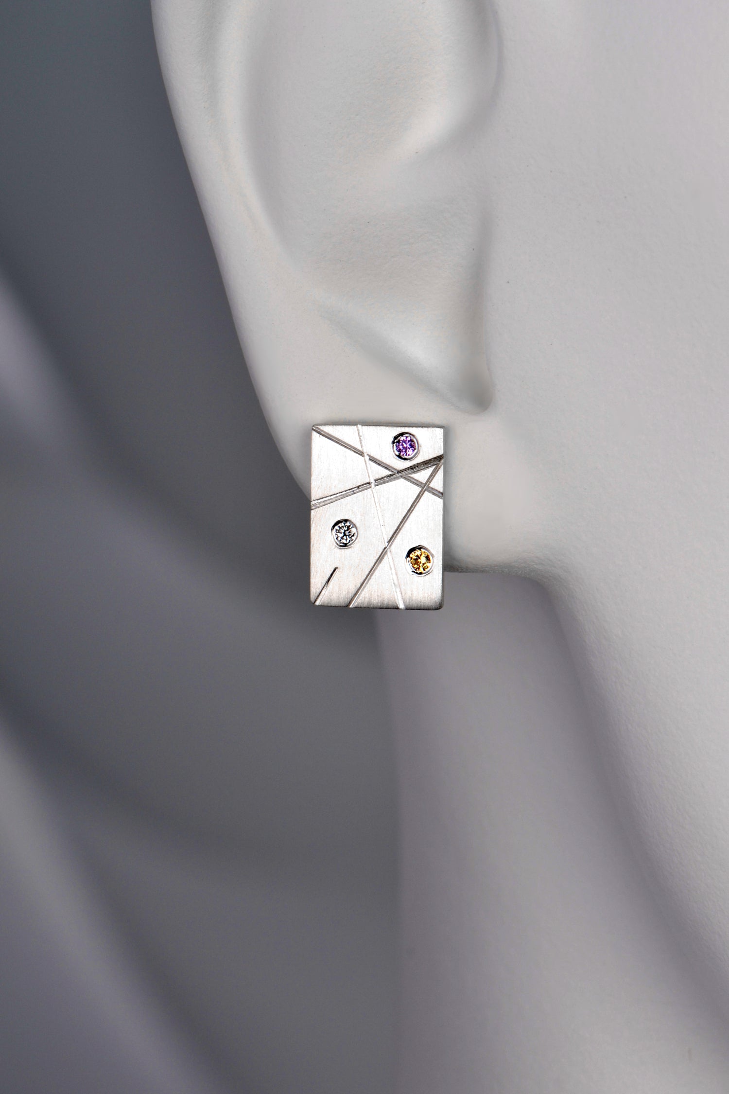 silver rectangular stud earring set with multi coloured gemstones