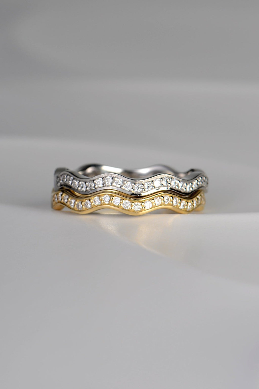 modern wavy diamond rings  in platinum and 18ct gold that stack - made in the UK