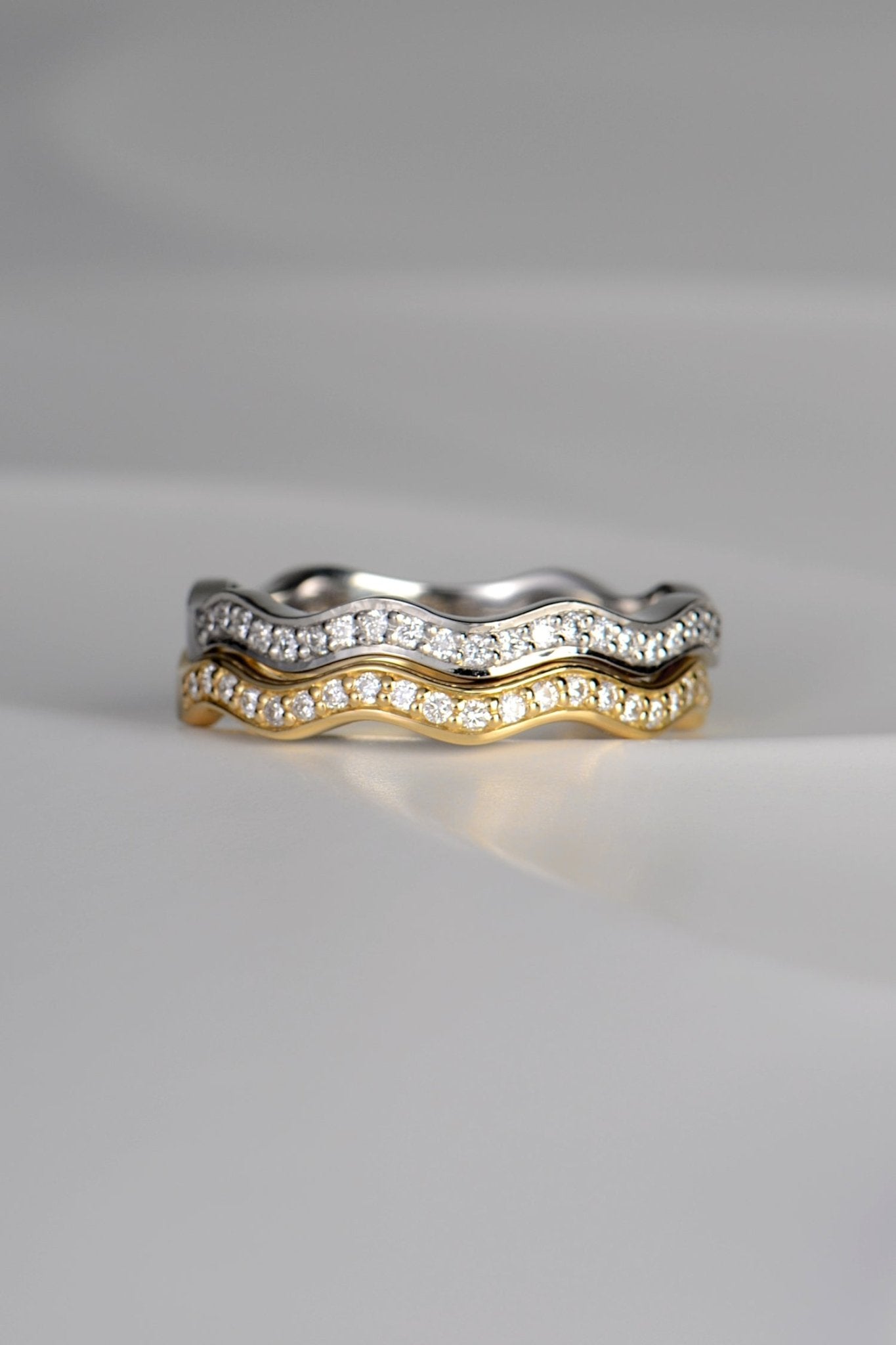 modern wavy diamond rings  in platinum and 18ct gold that stack - made in the UK