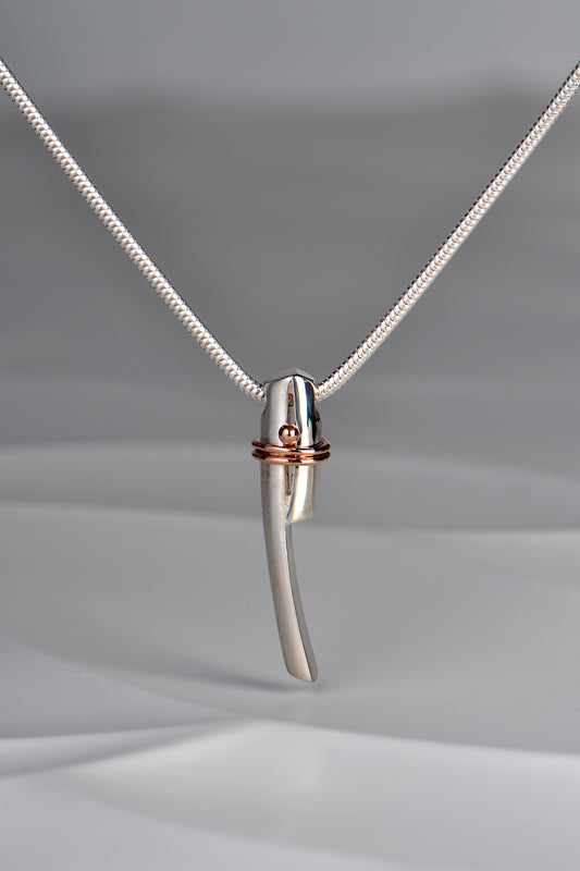 designer silver and rose gold necklace. Two sections of silver held by a rose gold wire that wraps around twice to symbolise a bond