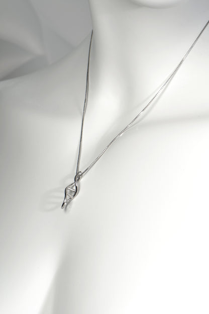 White mannequin showcasing the Life Double Helix Necklace to illustrate length and fit