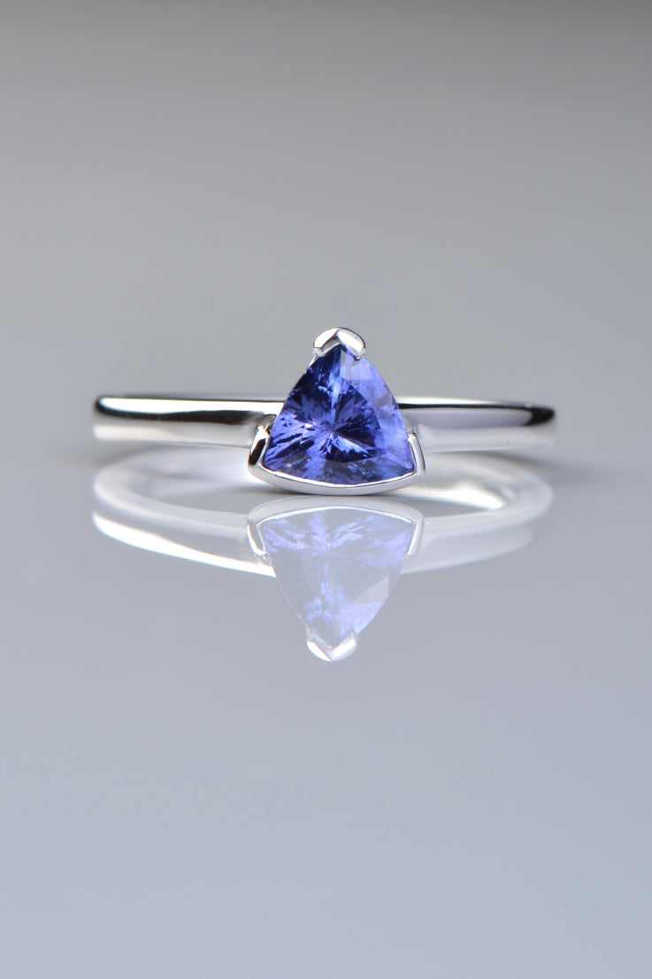 white gold tanzanite ring with a triangular gemstone. Designed by Christine Sadler and made in the UK