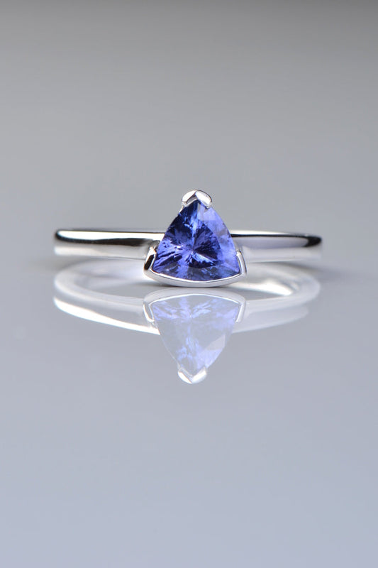 white gold tanzanite ring with a triangular gemstone. Designed by Christine Sadler and made in the UK