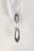 three interlocking organic oval links form a long drop silver earring with a textured pattern on the links inspired by the natural beauty of frost patterns - Christine Sadler