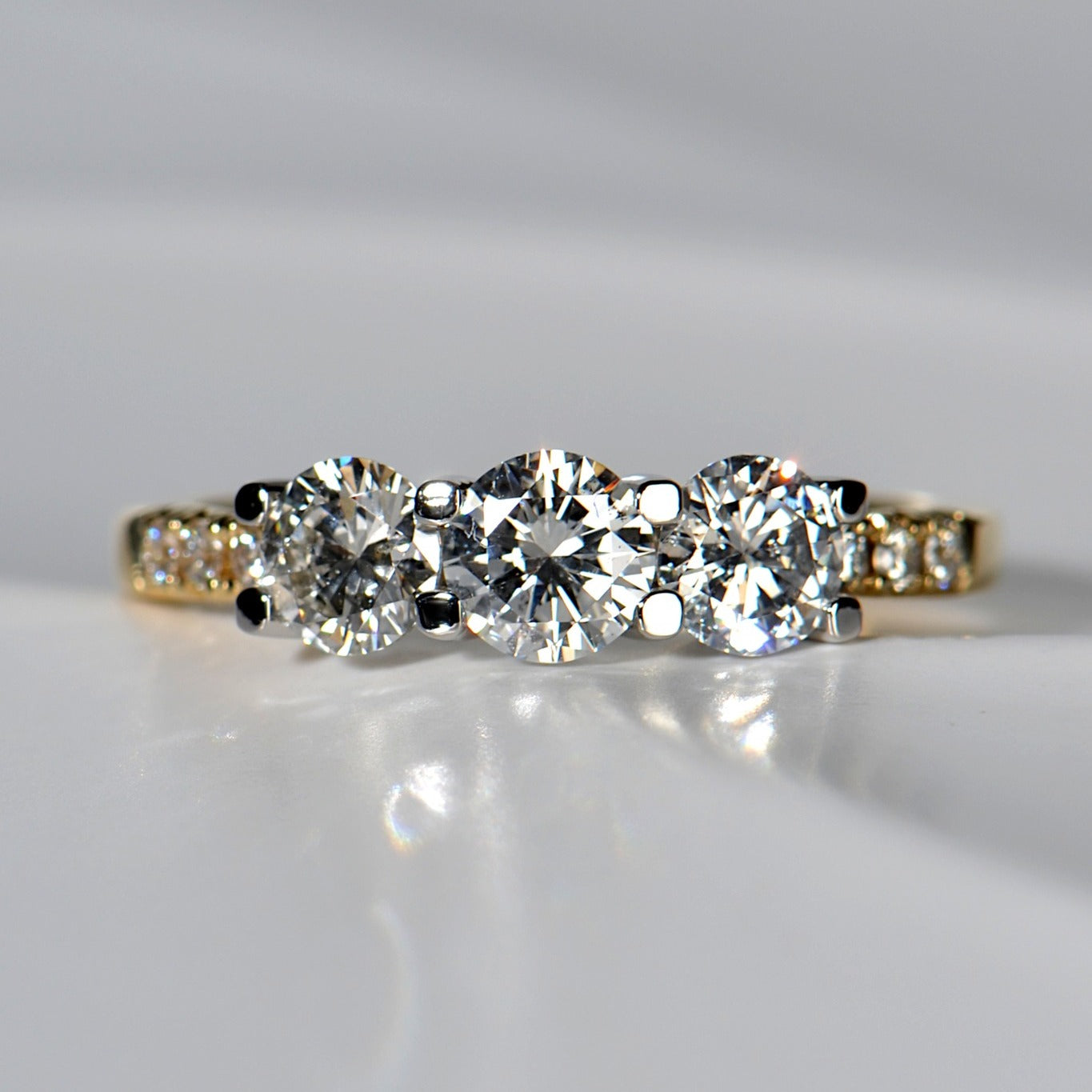 two tone platinum and 18ct yellow gold three stone diamond engagement ring with diamond set shoulders, remodelled from an original engagement ring to update it - Christine Sadler