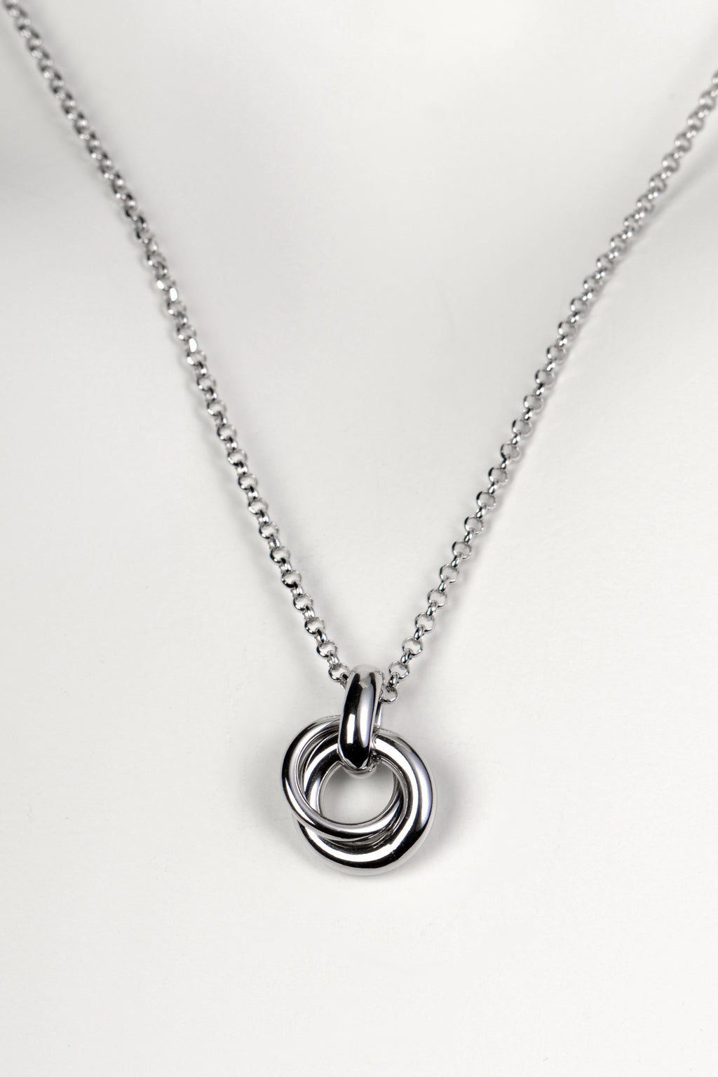 Silver friendship necklace from Christine Sadler. Two small circular rings interlock to form the pendant and they represent a special bond between two people.