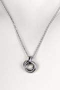 Silver friendship necklace from Christine Sadler. Two small circular rings interlock to form the pendant and they represent a special bond between two people.