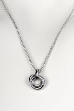 Silver friendship necklace from Christine Sadler. Two small circular rings interlock to form the pendant and they represent a special bond between two people.