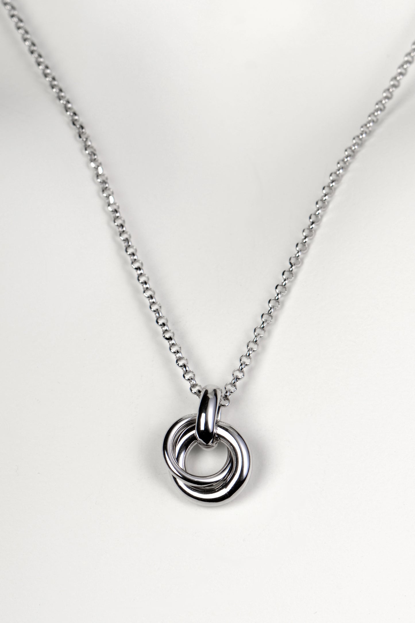 Silver friendship necklace from Christine Sadler. Two small circular rings interlock to form the pendant and they represent a special bond between two people.