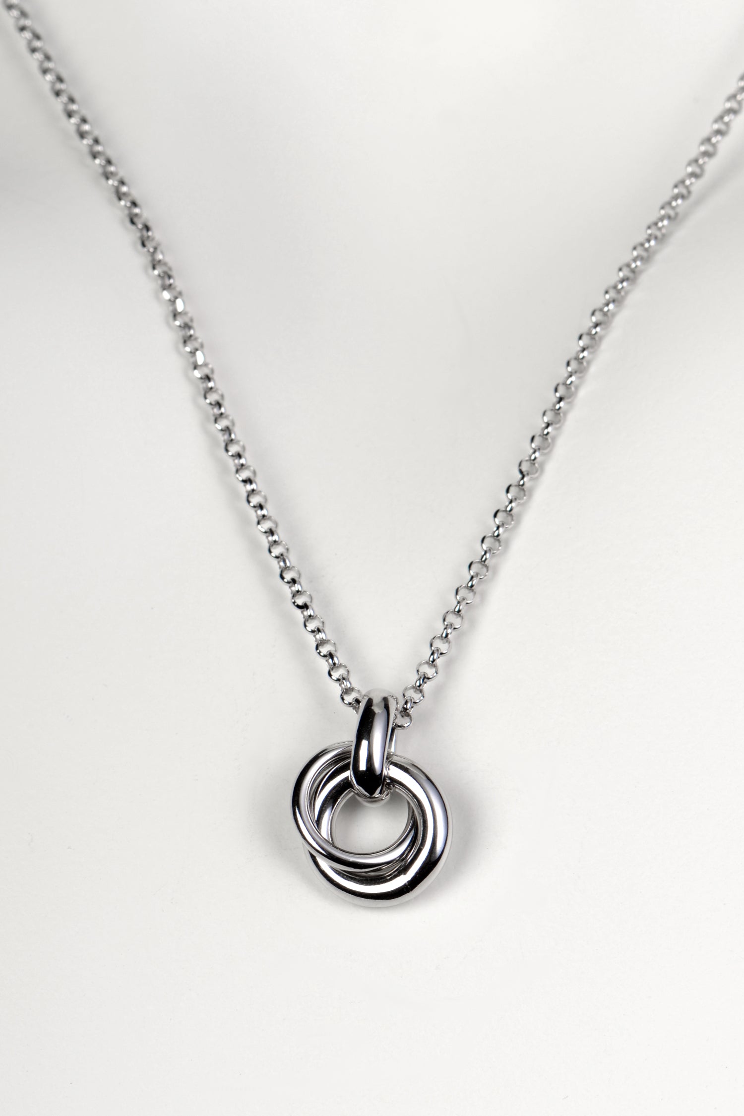 Silver friendship necklace from Christine Sadler. Two small circular rings interlock to form the pendant and they represent a special bond between two people.