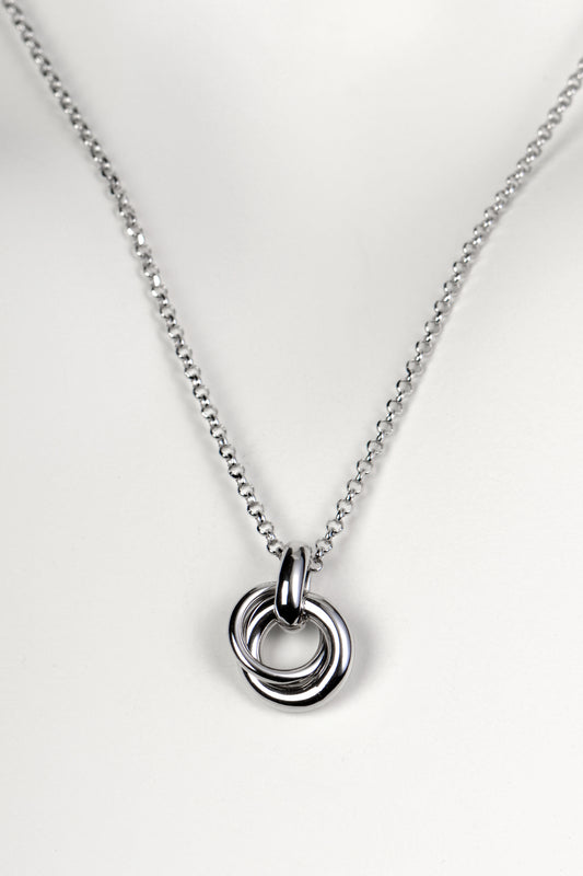 Silver friendship necklace from Christine Sadler. Two small circular rings interlock to form the pendant and they represent a special bond between two people.