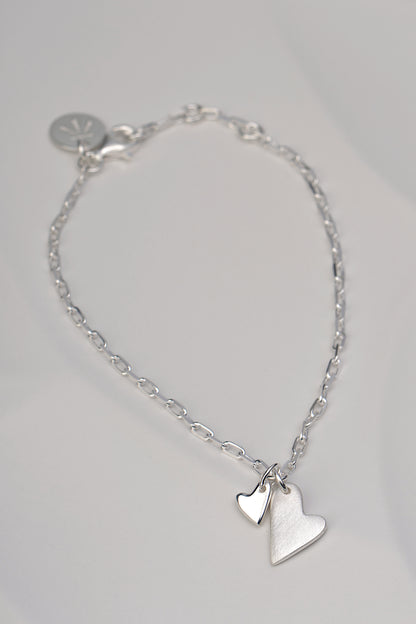 delicate real silver handmade bracelet with two hearts from jewellery designer Christine Sadler