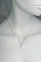 Sterling silver necklace with two heart pendants — one large matt heart and one small polished heart, From The Heart collection on white mannequin to show size and scale
